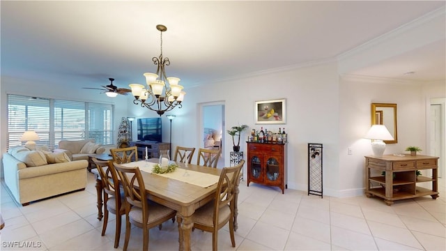 tiled dining area featuring crown molding and ceiling fan with notable chandelier