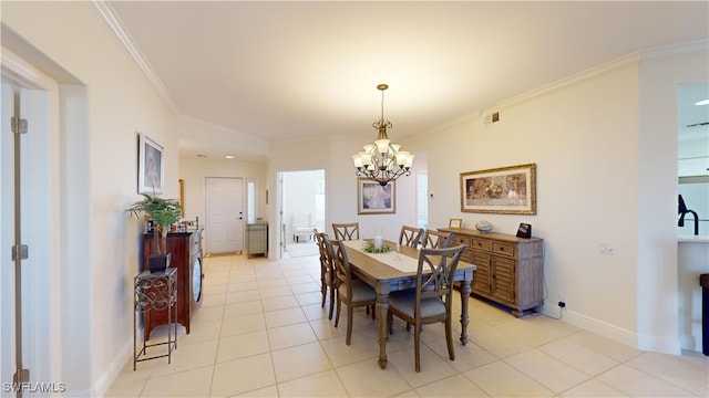 tiled dining room featuring crown molding and a notable chandelier