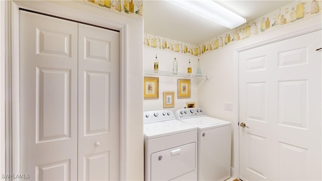 laundry room featuring washer and clothes dryer