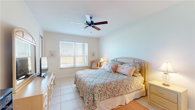 tiled bedroom with ceiling fan