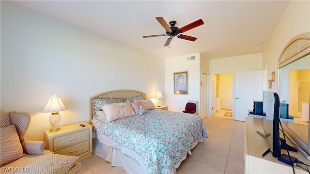 tiled bedroom featuring ceiling fan