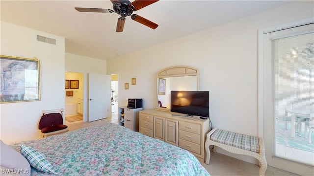 tiled bedroom featuring ceiling fan