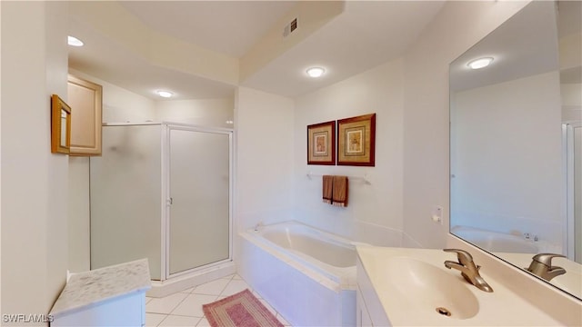 bathroom with tile patterned floors, plus walk in shower, and vanity