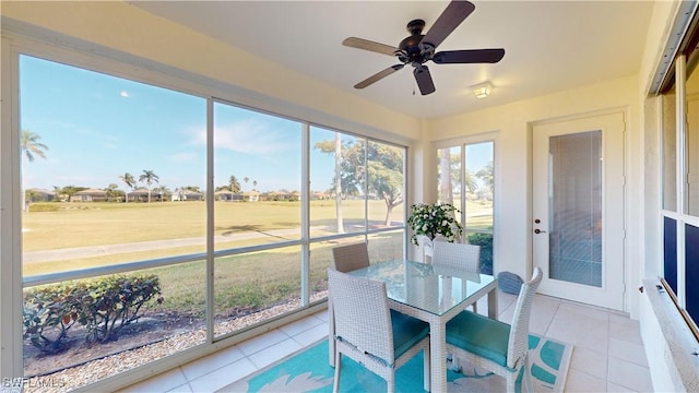 sunroom / solarium with ceiling fan