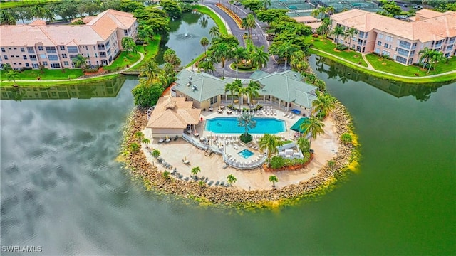 birds eye view of property with a water view