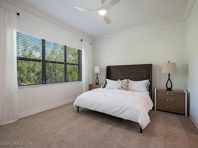 bedroom featuring crown molding, carpet flooring, and ceiling fan