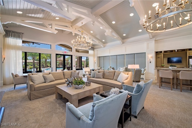 carpeted living room with beam ceiling, a chandelier, high vaulted ceiling, and french doors