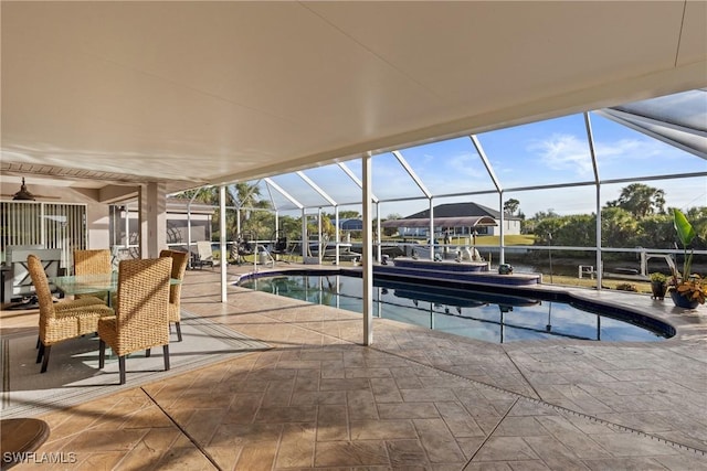 pool with glass enclosure and a patio area