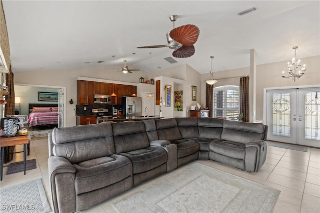 living room with light tile patterned floors, french doors, vaulted ceiling, and visible vents