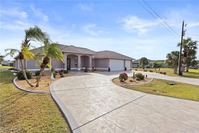 view of front of property featuring a garage, a front lawn, curved driveway, and stucco siding