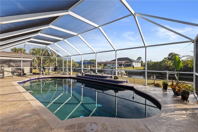 outdoor pool featuring a lanai and a patio