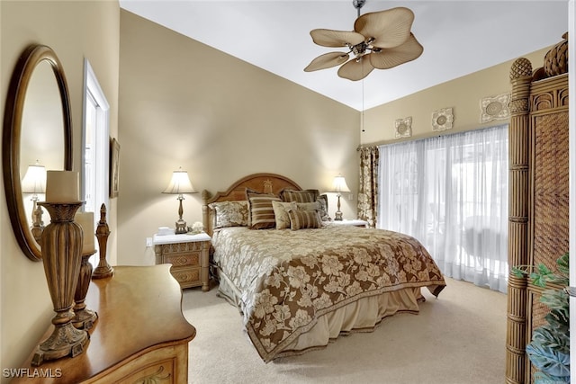 carpeted bedroom with ceiling fan and lofted ceiling