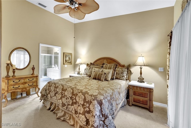 carpeted bedroom featuring connected bathroom and ceiling fan