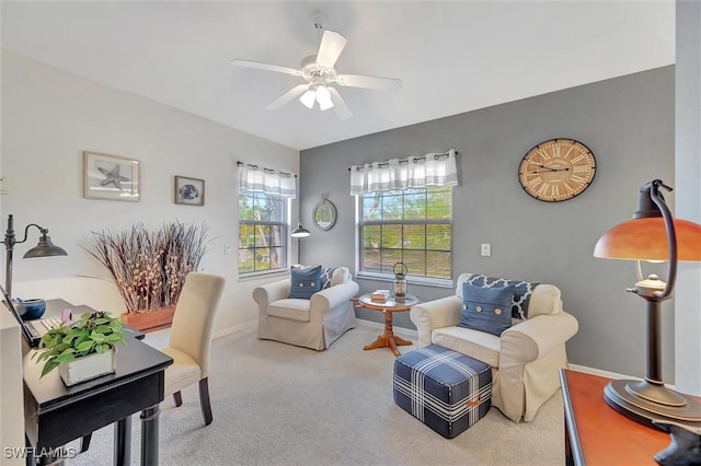 living area with ceiling fan and carpet floors