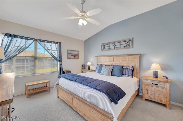 carpeted bedroom featuring vaulted ceiling and ceiling fan