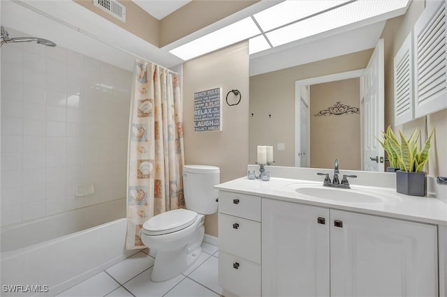 full bathroom featuring vanity, toilet, tile patterned floors, and shower / bath combo with shower curtain