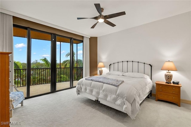 bedroom with light carpet, access to exterior, and ceiling fan