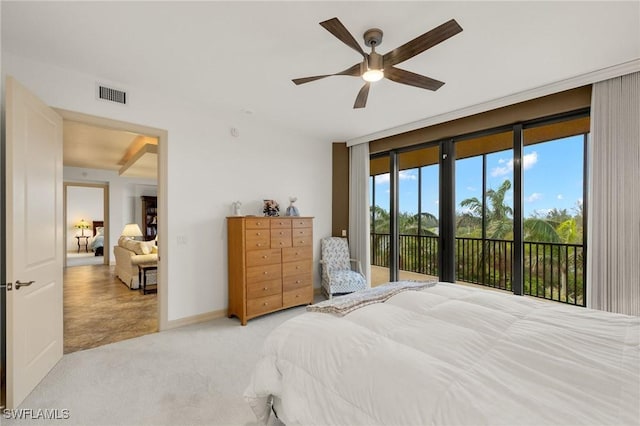 bedroom with access to exterior, visible vents, light colored carpet, a wall of windows, and baseboards