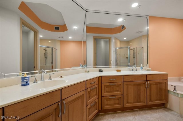 bathroom featuring vanity, tile patterned floors, and separate shower and tub