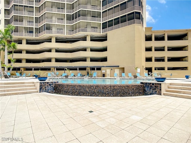 community pool with a patio