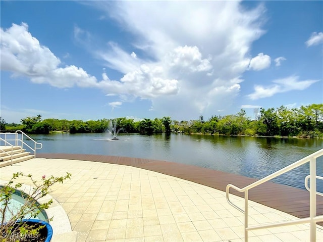 view of patio with a water view