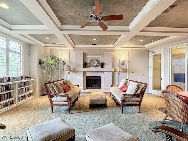 living room featuring coffered ceiling, beam ceiling, light colored carpet, and a tiled fireplace