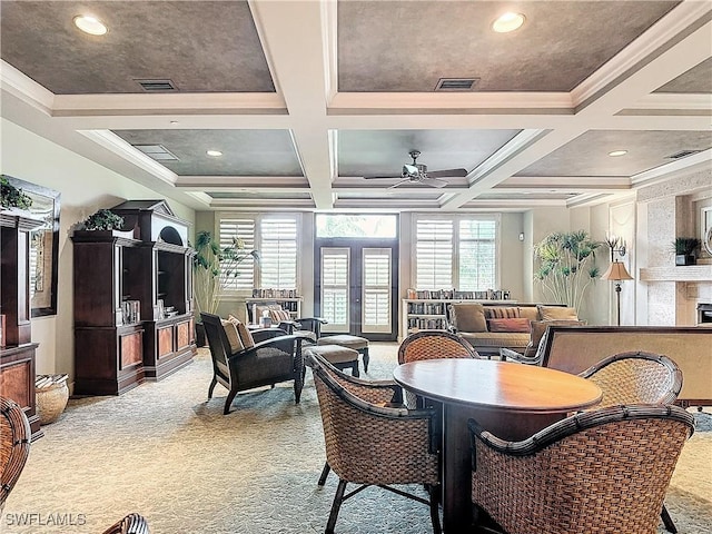 carpeted dining room with ornamental molding, coffered ceiling, beam ceiling, and a healthy amount of sunlight