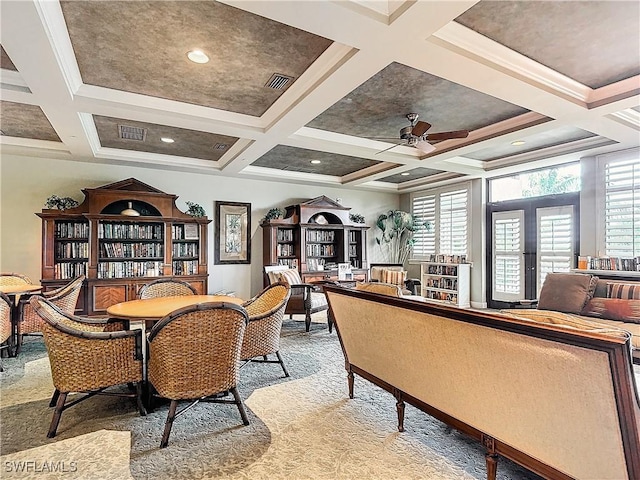 carpeted dining area featuring ceiling fan, coffered ceiling, ornamental molding, french doors, and beamed ceiling