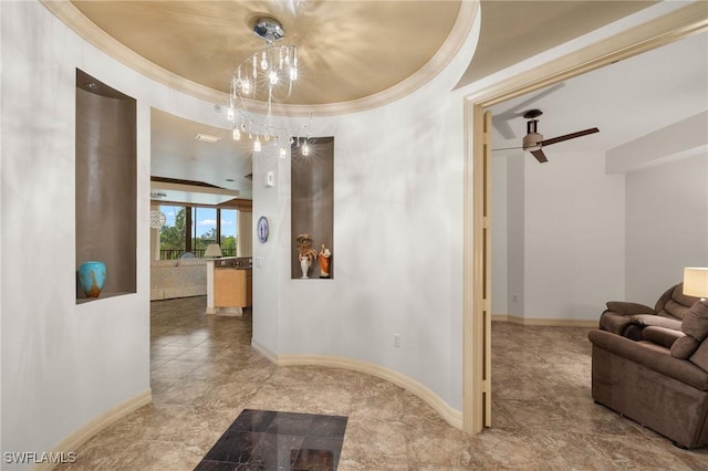 hallway featuring crown molding, a notable chandelier, and baseboards