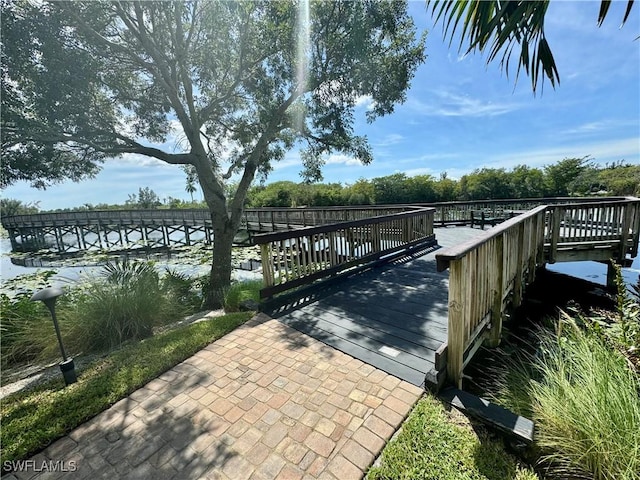 dock area featuring a water view