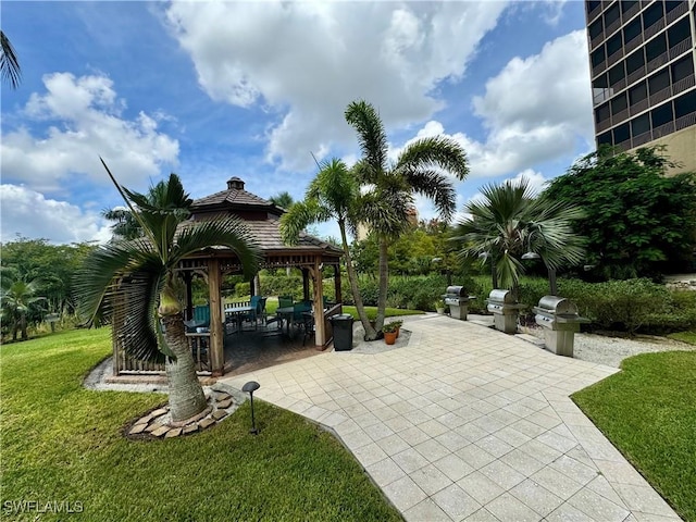 view of community with a patio, a lawn, and a gazebo