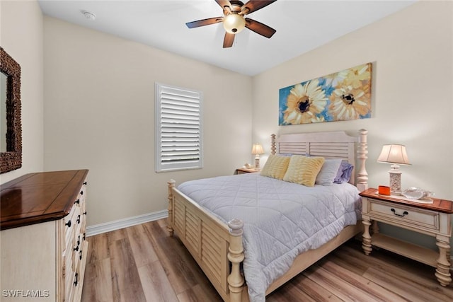 bedroom with ceiling fan and light hardwood / wood-style floors