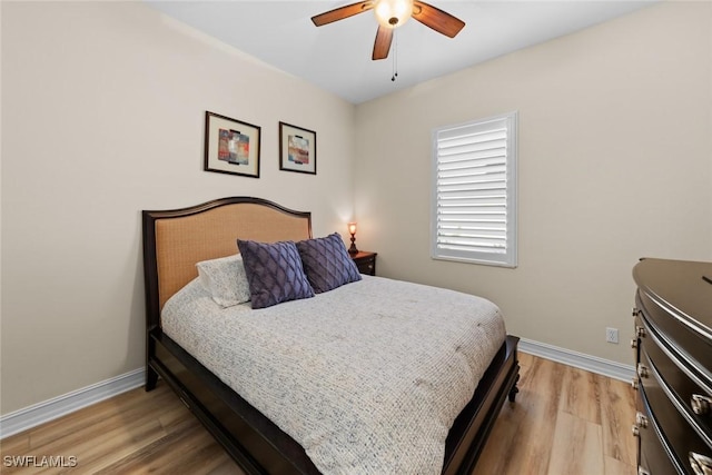 bedroom with ceiling fan and light wood-type flooring