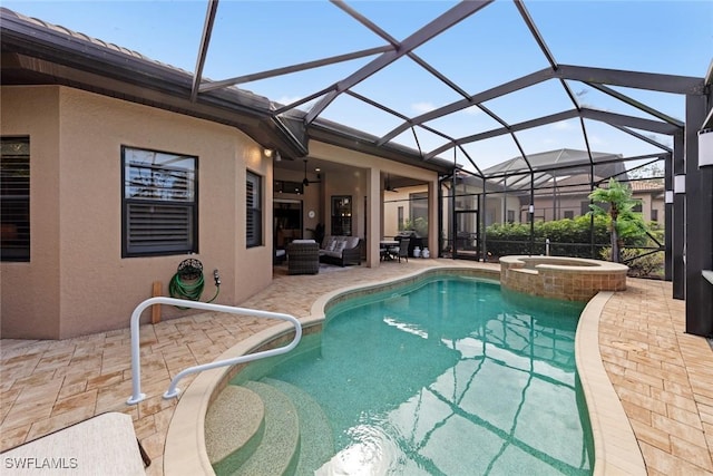 view of pool featuring a lanai, ceiling fan, outdoor lounge area, a patio, and an in ground hot tub