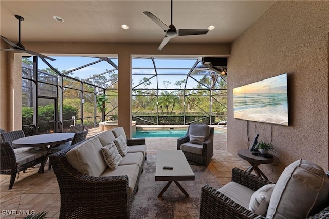 view of patio with outdoor lounge area and glass enclosure