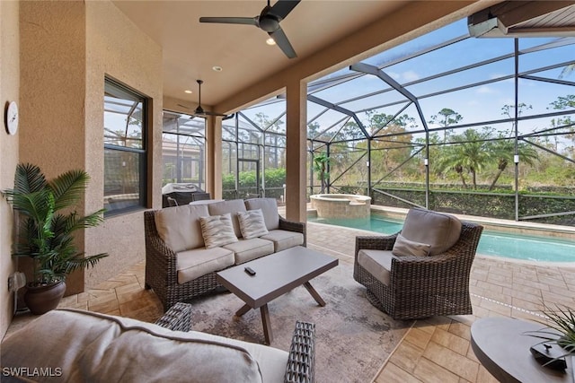 view of patio / terrace featuring a swimming pool with hot tub, outdoor lounge area, and glass enclosure