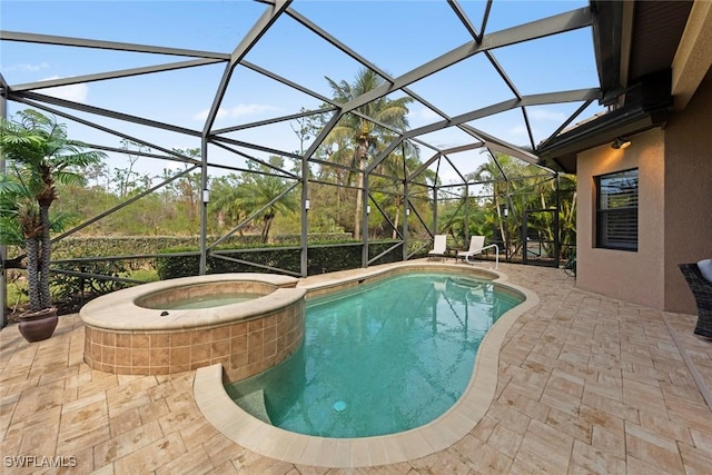 view of pool featuring a lanai, a patio, and an in ground hot tub