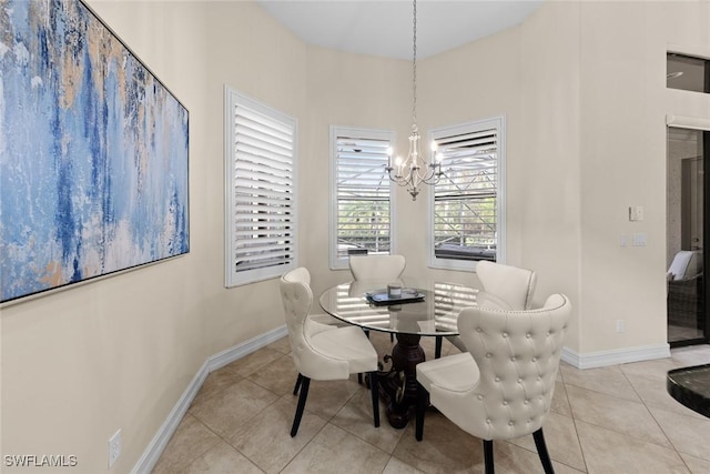 dining room with light tile patterned flooring and a chandelier