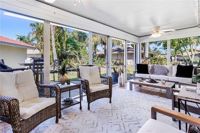 sunroom / solarium with plenty of natural light and ceiling fan