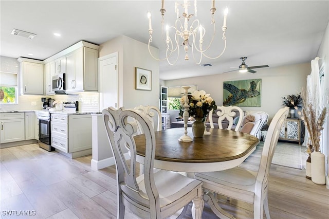 dining room featuring ceiling fan, light hardwood / wood-style flooring, and a healthy amount of sunlight