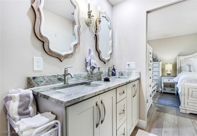 bathroom featuring hardwood / wood-style flooring and vanity