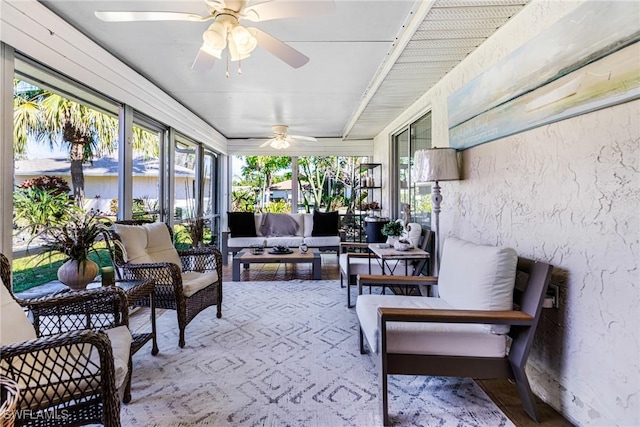 sunroom / solarium with a ceiling fan