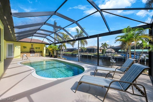 view of pool with a water view, a lanai, and a patio