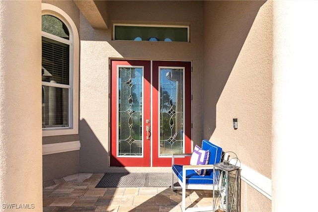 entrance to property featuring a patio area