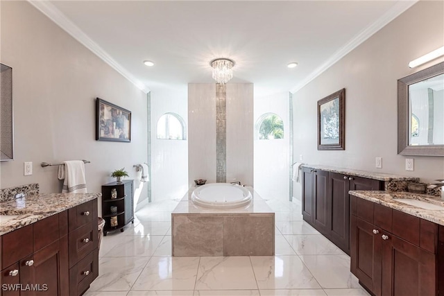 bathroom with vanity, tiled tub, and crown molding