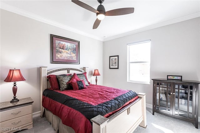 carpeted bedroom with access to outside, ornamental molding, and ceiling fan