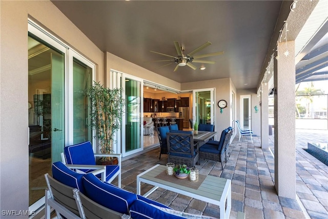 view of patio featuring ceiling fan