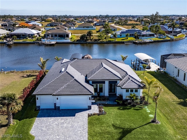 aerial view with a residential view and a water view