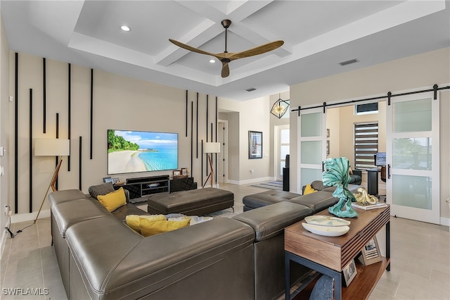 living area featuring ceiling fan, a barn door, recessed lighting, coffered ceiling, and visible vents