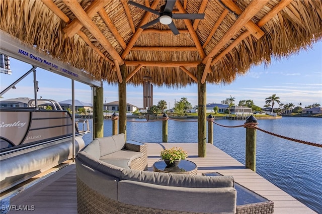 view of dock featuring a water view and an outdoor living space